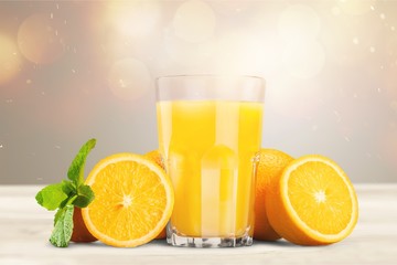 Orange juice and slices of orange on background © BillionPhotos.com
