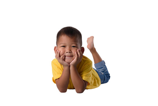 happy asian children lying on floor isolated white background