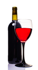 bottle and glass of red wine closeup