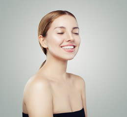Pretty smiling woman portrait. Beautiful girl face with clear skin portrait