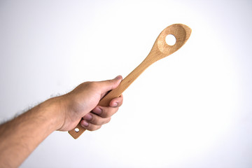 Male hand holding a jar of spice on white background