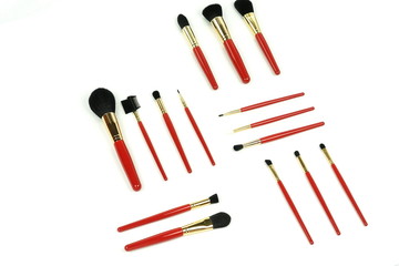 Makeup tools brushes set in red color on white background. Professional make up tools . Top view. Flat lay
