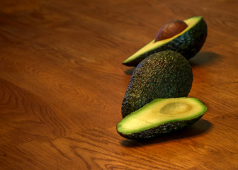 avocado superfood on oak wood table background, macro wth copy space