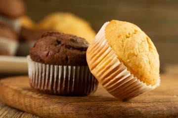 Chocolate cake and nut cake, homemade cakes on wooden background