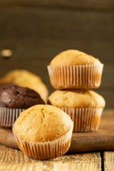 Chocolate cake and nut cake, homemade cakes on wooden background