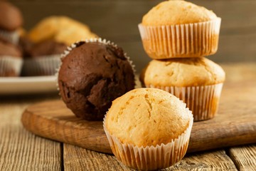 Chocolate cake and nut cake, homemade cakes on wooden background