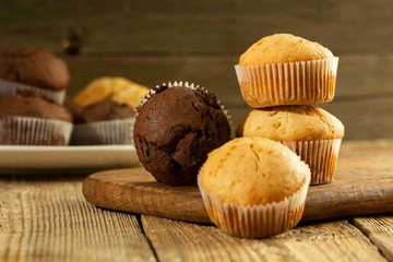 Chocolate cake and nut cake, homemade cakes on wooden background