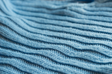 Fototapeta na wymiar blue knitwear texture macro selective focus