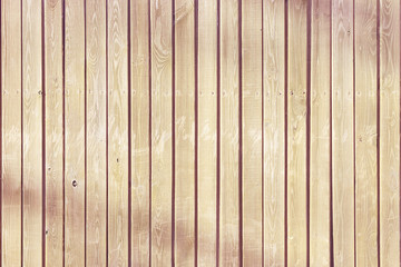 Wooden fence of flat vertical boards, background.