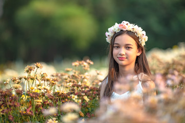 Beautiful girl and flowers field.