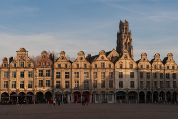 Fototapeta premium Typical Flemish medieval house facades on a square with a church behind