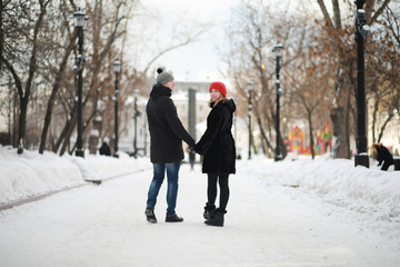 Young couple walking through the winter