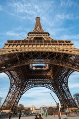 Wide shot of Eiffel Tower with blue sky in Paris