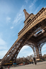 Wide shot of Eiffel Tower with blue sky in Paris