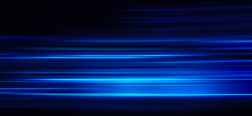 Abstract blue light trails on the dark background