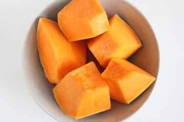 Slice of ripe orange pumpkin. Pumpkin slice on white background. 
