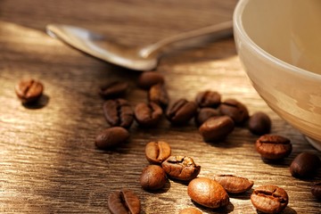 cup of coffee with beans and cinnamon