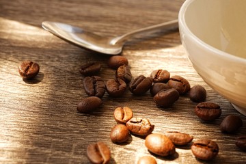 cup of coffee with beans and cinnamon