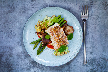 Halibut with hazelnut crust with roast red pepper sauce, asparagus, cauliflower and shiitake...