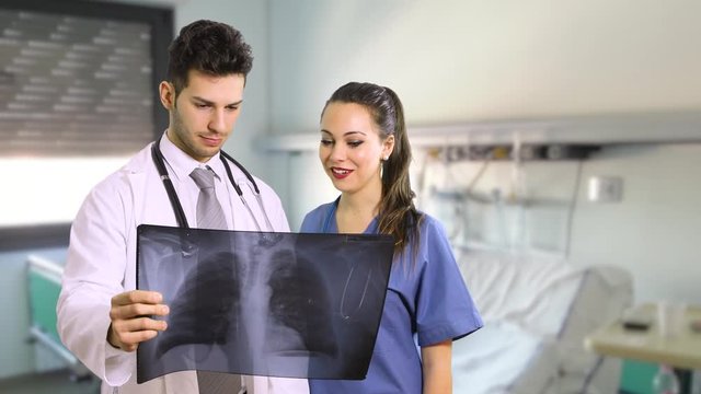 Doctor and nurse analyzing a lung radiograhy in a hospital