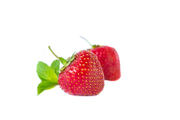 Close up of two strawberries isolated on white