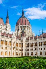 Fototapeta na wymiar Gothic building of Parliament in Budapest, Hungary. Bright blue summer sky. 