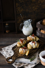 Baked potato with bacon and fresh yogurt
