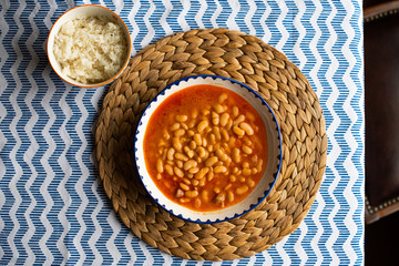 kurufasulye aka baked white beans, traditional turkish food with pilaf