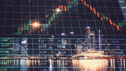 Trading graph on the cityscape at night background. Business and financial concept. Double exposure. Singapore