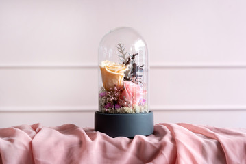 Long-lasting roses in a glass dome