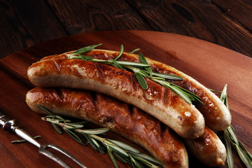 Grilled sausages with spices on a wooden table - Home-made Pork Sausages