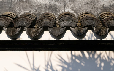 Traditional beautiful ancient chinese textured on the wall of Chinese building in the garden