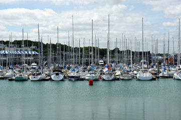 Fototapeta premium Boats, masts, clouds.Marina in the port of Howth.Ireland. 