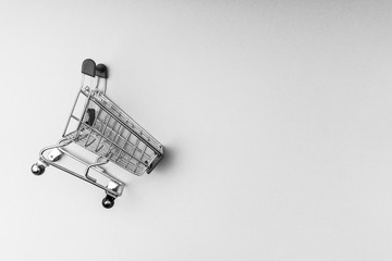 Shopping cart on black and white background, business and shopping concept. Selective focus