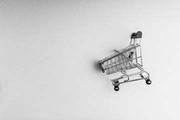 Shopping cart on black and white background, business and shopping concept. Selective focus