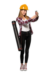 A full-length shot of a Architect woman making a selfie over isolated white background