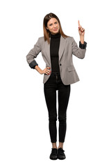 A full-length shot of a Business woman showing and lifting a finger in sign of the best over...
