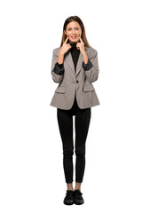 Fototapeta premium A full-length shot of a Business woman smiling with a happy and pleasant expression over isolated white background