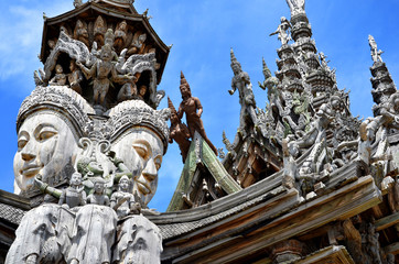 Asian wooden sculpture on the sky background