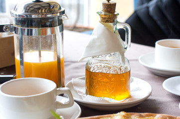 sea buckthorn tea. A hot drink and a glass bottle of oil.