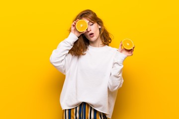 Young redhead woman with orange slices