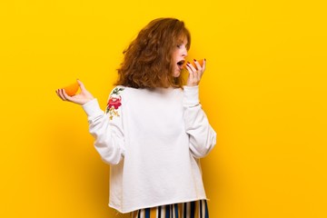 Young redhead woman with orange slices