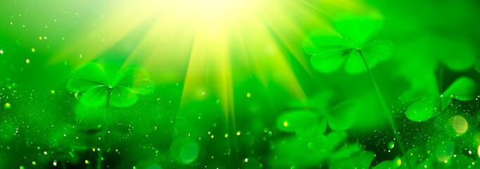 St. Patrick's Day green blurred background with shamrock leaves. Patrick Day. Abstract border art...
