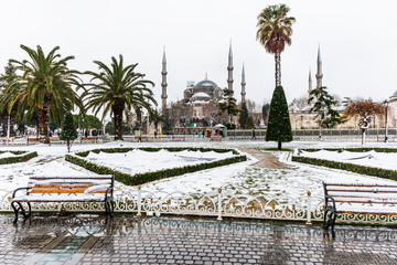 Snowy day in Sultanahmet Square and Blue Mosque (Sultanahmet Camii). Istanbul, Turkey..