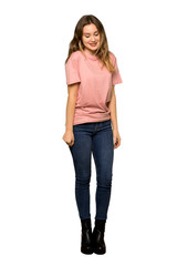 A full-length shot of a Teenager girl with pink sweater thinking an idea while looking up on isolated white background