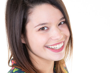 Studio portrait of an excited young woman face smiling beauty