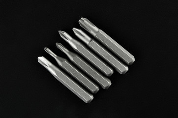 Set of bits for screwdriver. Metal bits for screwdriver. Tool set for household use. Nozzles and adapters for screwdrivers. Head different size hex driver.