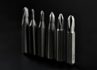 Set of bits for screwdriver. Metal bits for screwdriver. Tool set for household use. Nozzles and adapters for screwdrivers. Head different size hex driver.