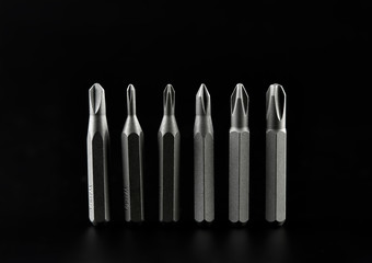 Set of bits for screwdriver. Metal bits for screwdriver. Tool set for household use. Nozzles and adapters for screwdrivers. Head different size hex driver.