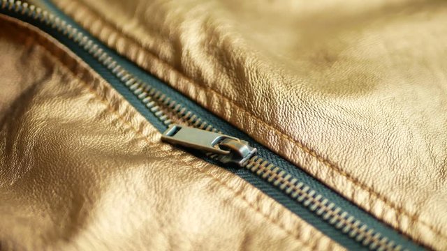 Unzipped brown leather jacket